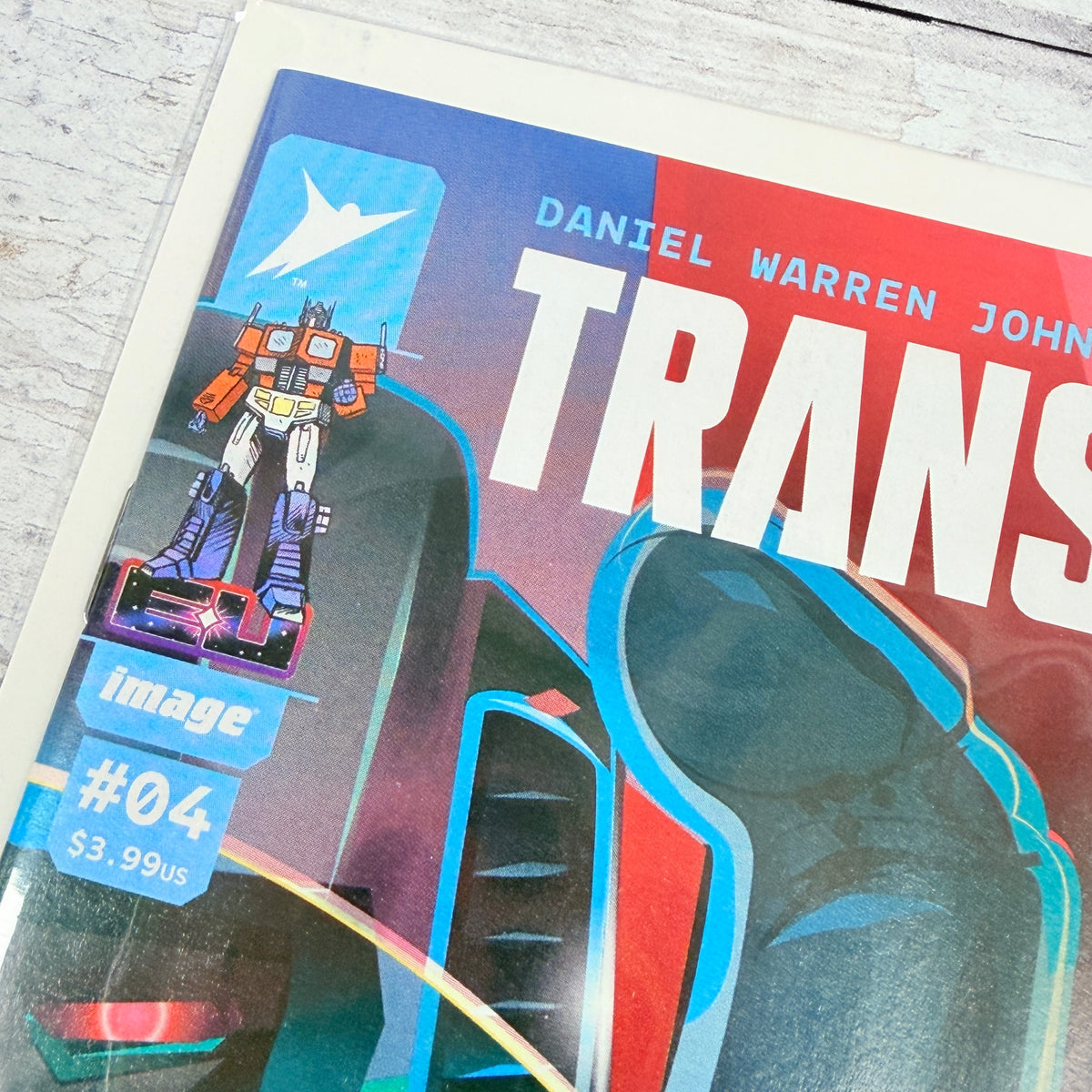 Transformers #4 (2024) Orlando Arocena Cover C: upper-left front corner and issue detail of the actual pre-owned copy.