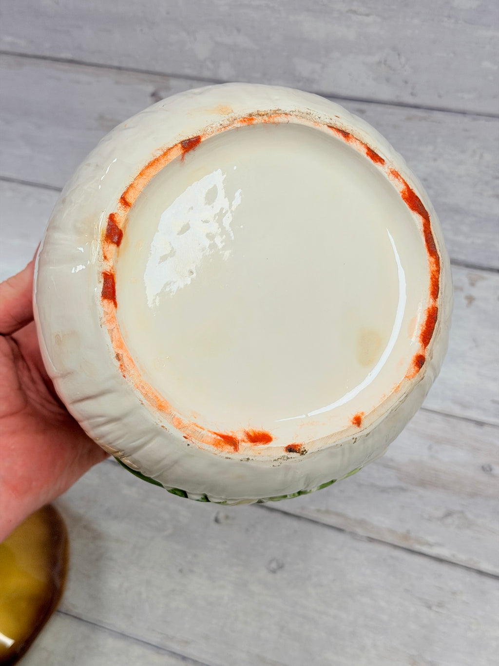 Underside of ceramic mushroom canister showing wear