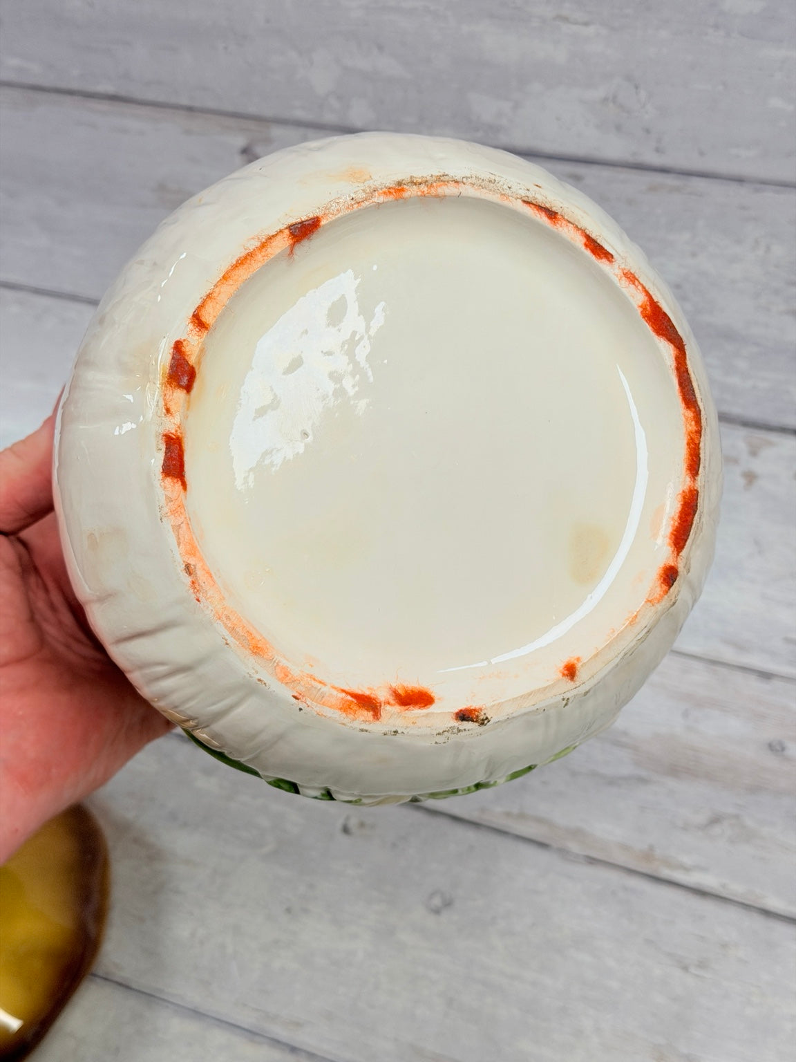 Underside of ceramic mushroom canister showing wear