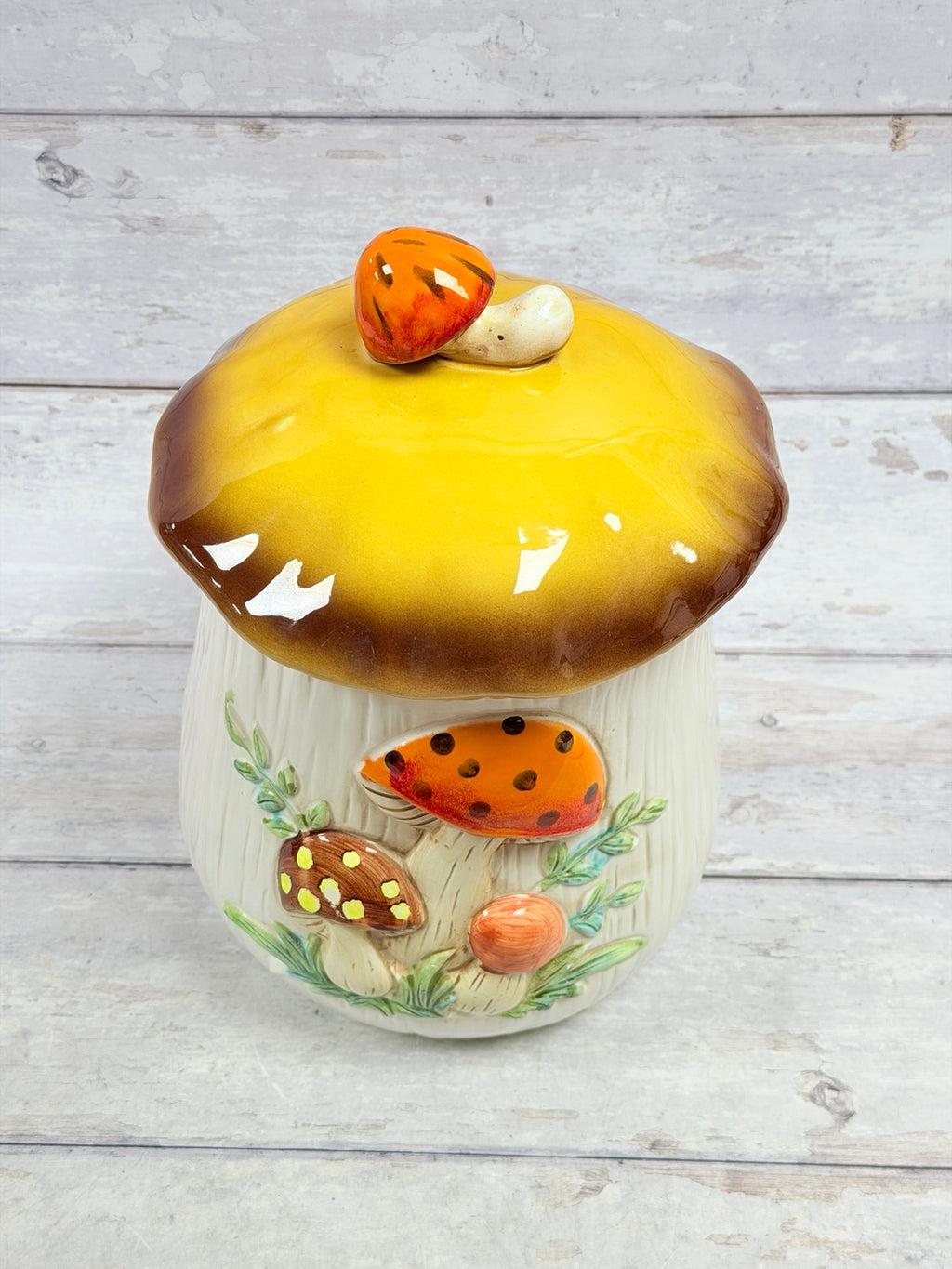 Ceramic mushroom canister, alternate front view showing mushroom decoration