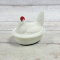 White milk glass Westmoreland hen on nest with red comb, front view