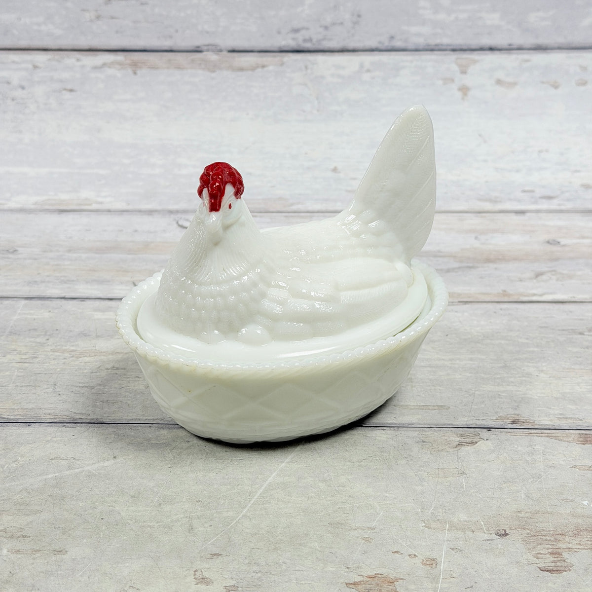 White milk glass Westmoreland hen on nest with red comb, front view