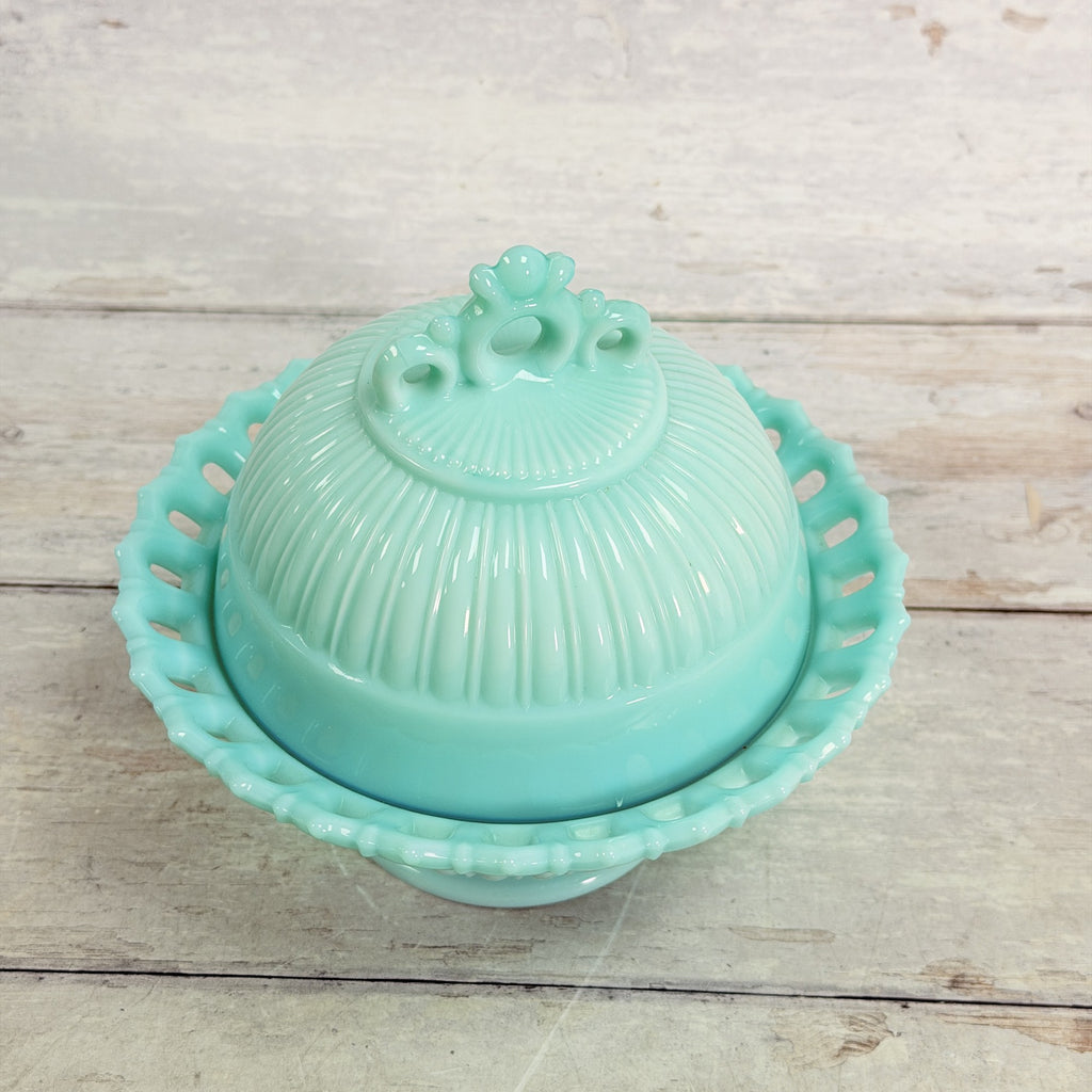 Top view of Fostoria Randolph aqua blue milk glass candy dish showing ribbed lid and pierced finial.