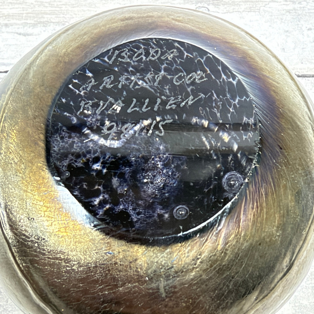 Underside of Boda Artist Collection paperweight showing etched signature and number