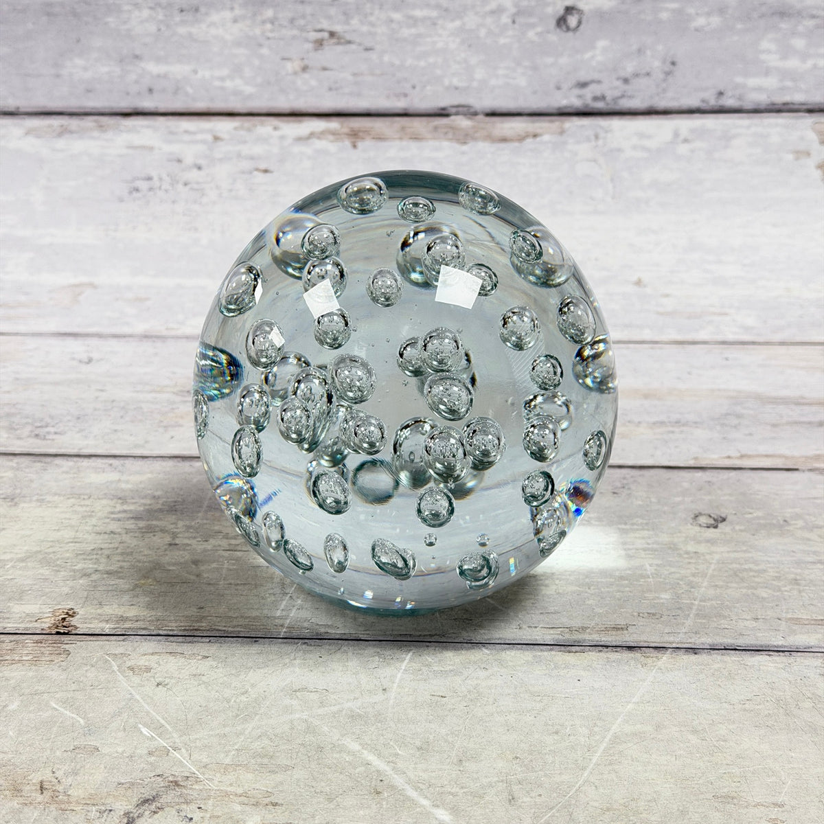 Large clear bubble glass paperweight with rounded oval form, approximately 5lb, front view