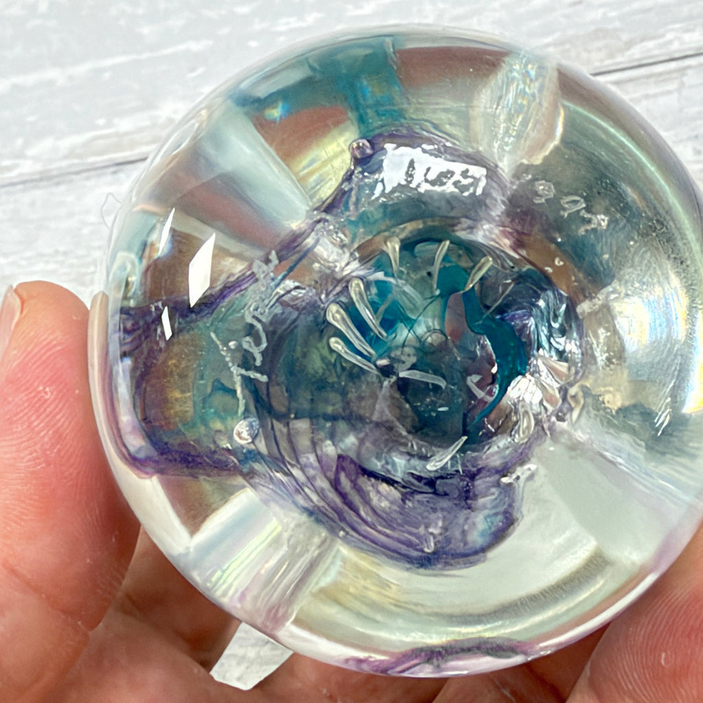 Alternate view of the engraved studio signature and 1997 date on the paperweight base