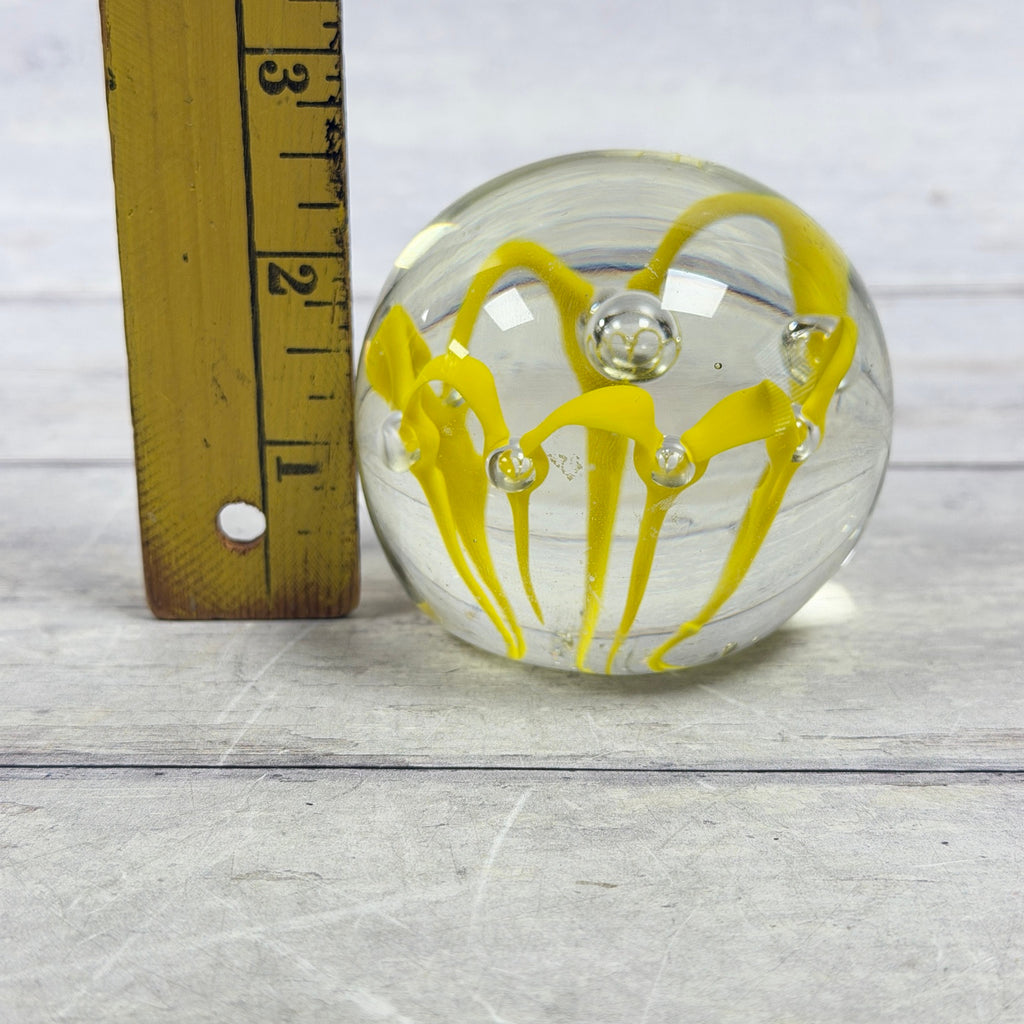 Paperweight beside ruler showing approximate height