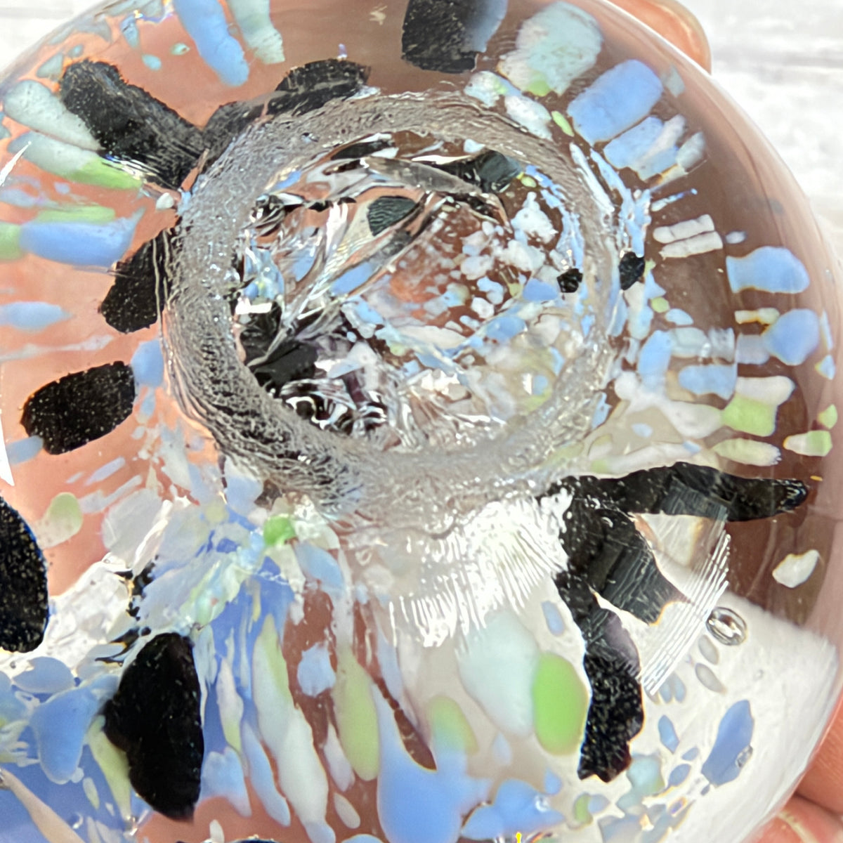 Blue, White and Black Floral Bubble Glass Paperweight, close-up of surface or underside; display props not included