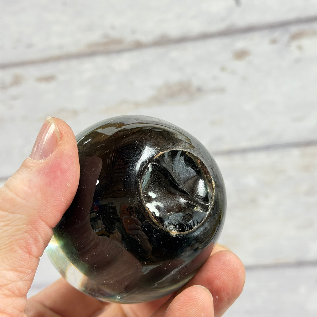 Dark Green Glass Apple Paperweight, close-up of surface or underside; display props not included