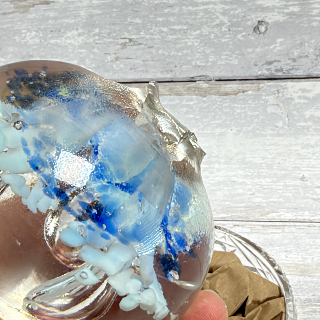 Pale blue floral controlled-bubble glass paperweight base detail