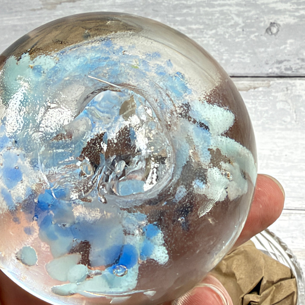 Pale blue floral controlled-bubble glass paperweight base detail