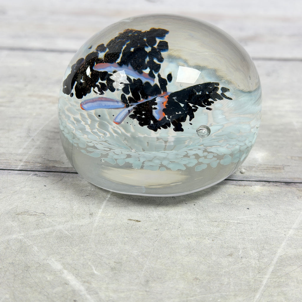 Black and Pale Blue Frit Glass Paperweight with Orange-Lavender Ribbons - product view