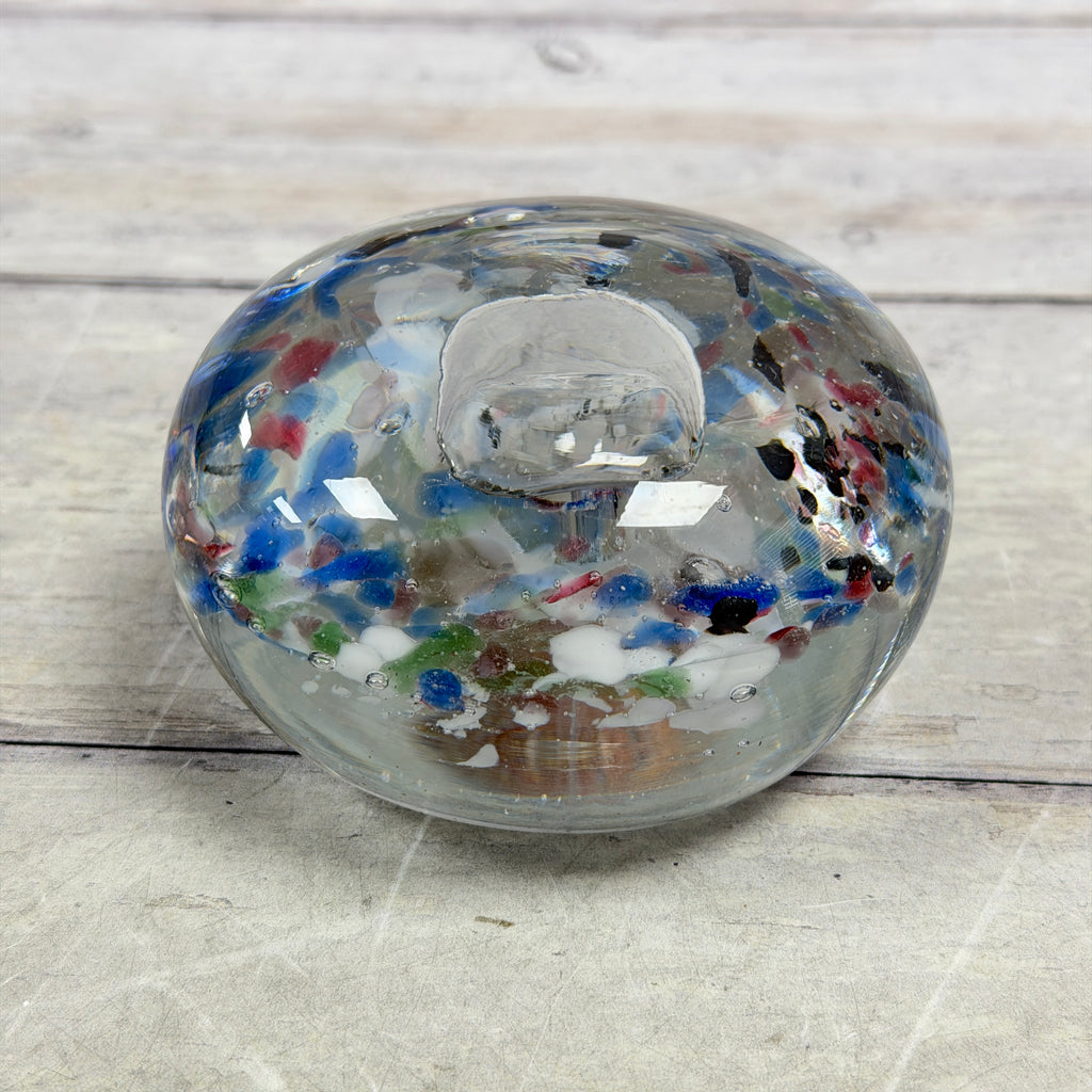 Multicolor frit glass paperweight with large central bubble, front view